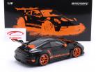 Porsche 911 (992) GT3 RS Ano de construção 2022 preto / laranja aros 1:18 Minichamps