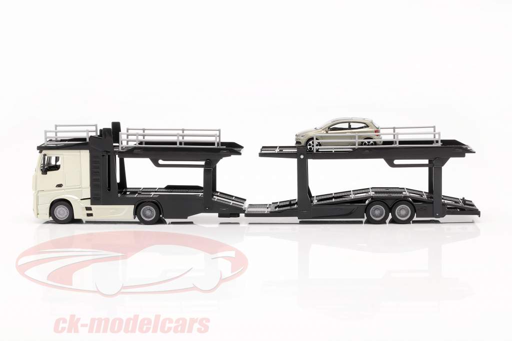 Mercedes-Benz Actros transporteur de voitures avec VW Polo GTI or / noir / gris métallique 1:43 Bburago