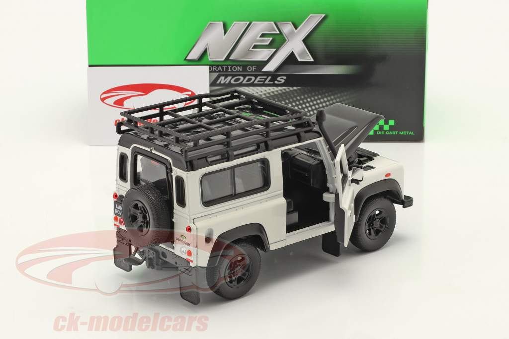 Land Rover Defender insieme a tetto cremagliera bianco / Nero 1:24 Welly