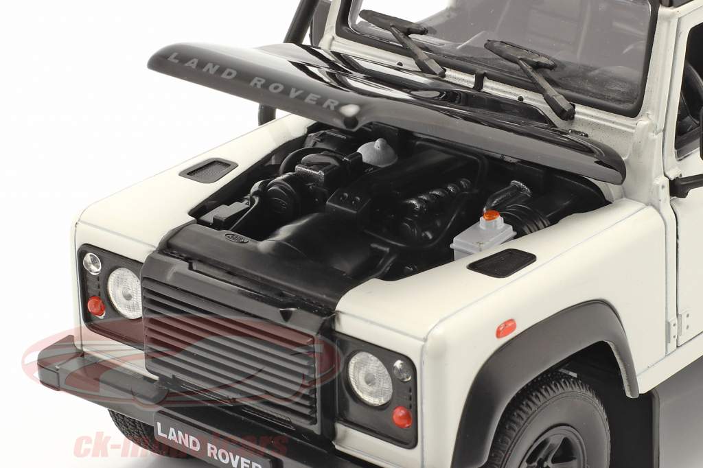 Land Rover Defender met dak rek wit / zwart 1:24 Welly