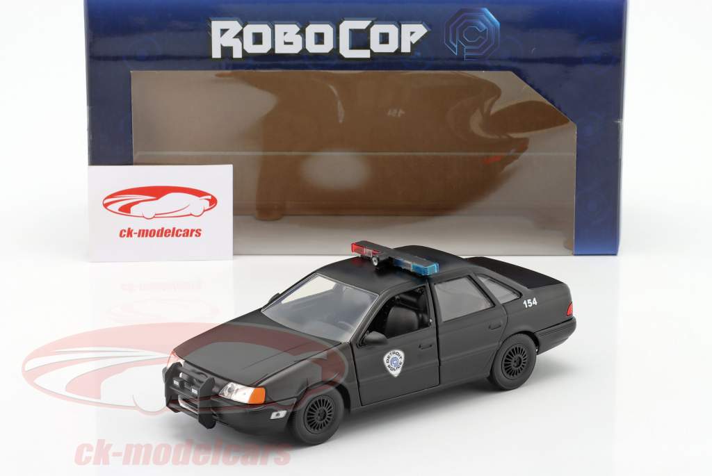 Ford Taurus OCP Anno di costruzione 1986 Film Robocop con figura Robocop 1:24 Jada Toys