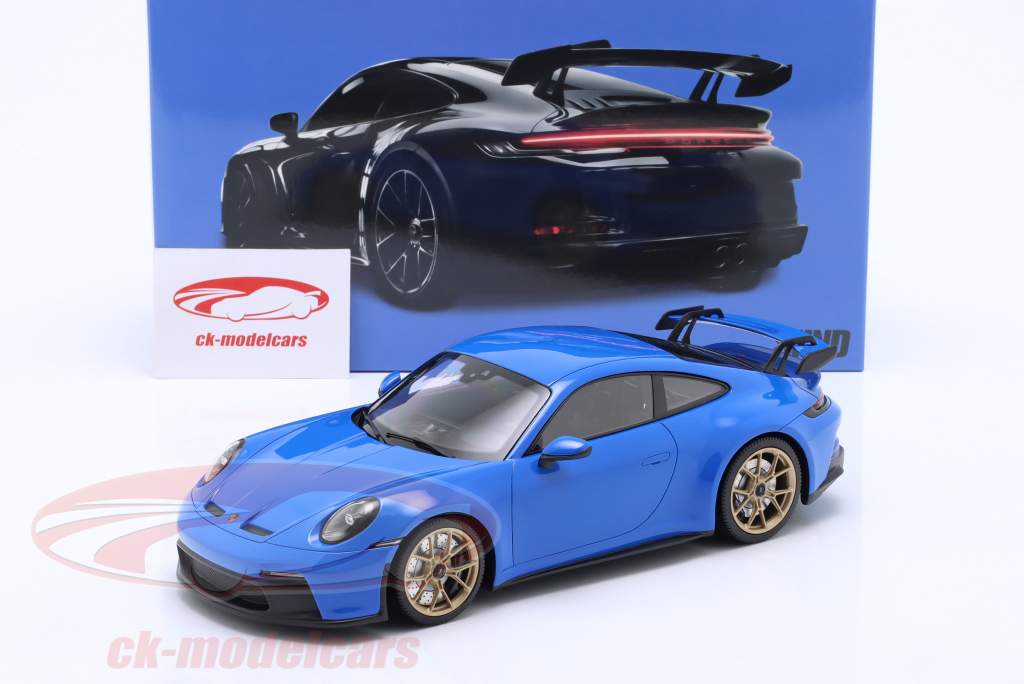 Porsche 911 (992) GT3 2021 Tubarão azul / dourado aros 1:18 Minichamps