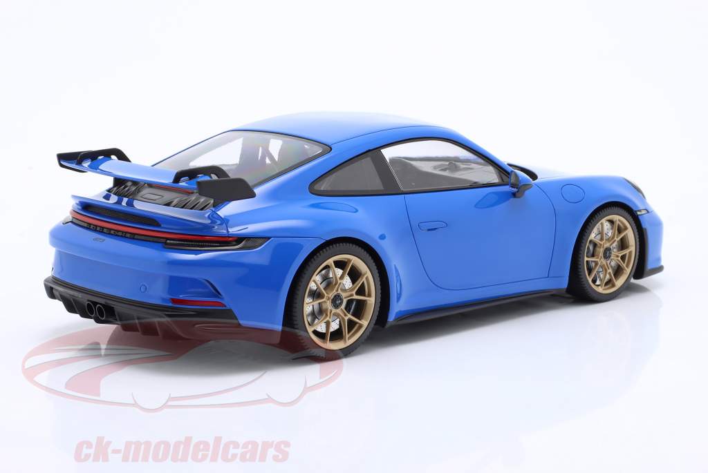 Porsche 911 (992) GT3 2021 haai blauw / gouden velgen 1:18 Minichamps