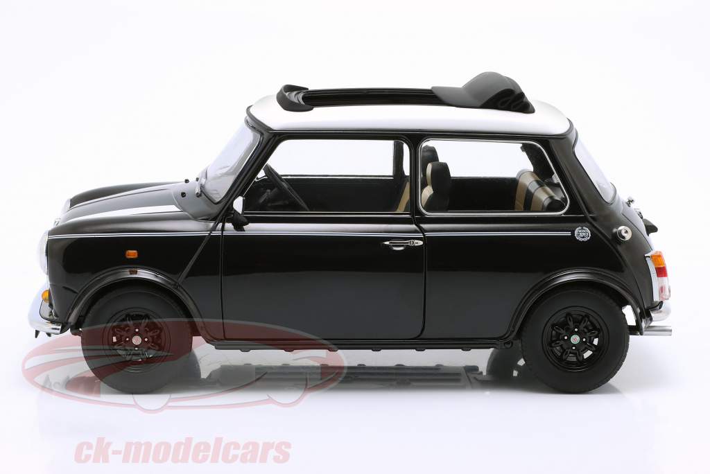 Mini Cooper avec toit ouvrant noir métallique / blanc RHD 1:12 KK-Scale