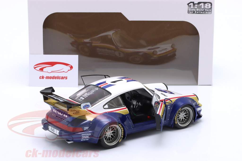Porsche 911 (964) RWB Rauh-Welt 2022 blå / hvid / rød / guld 1:18 Solido