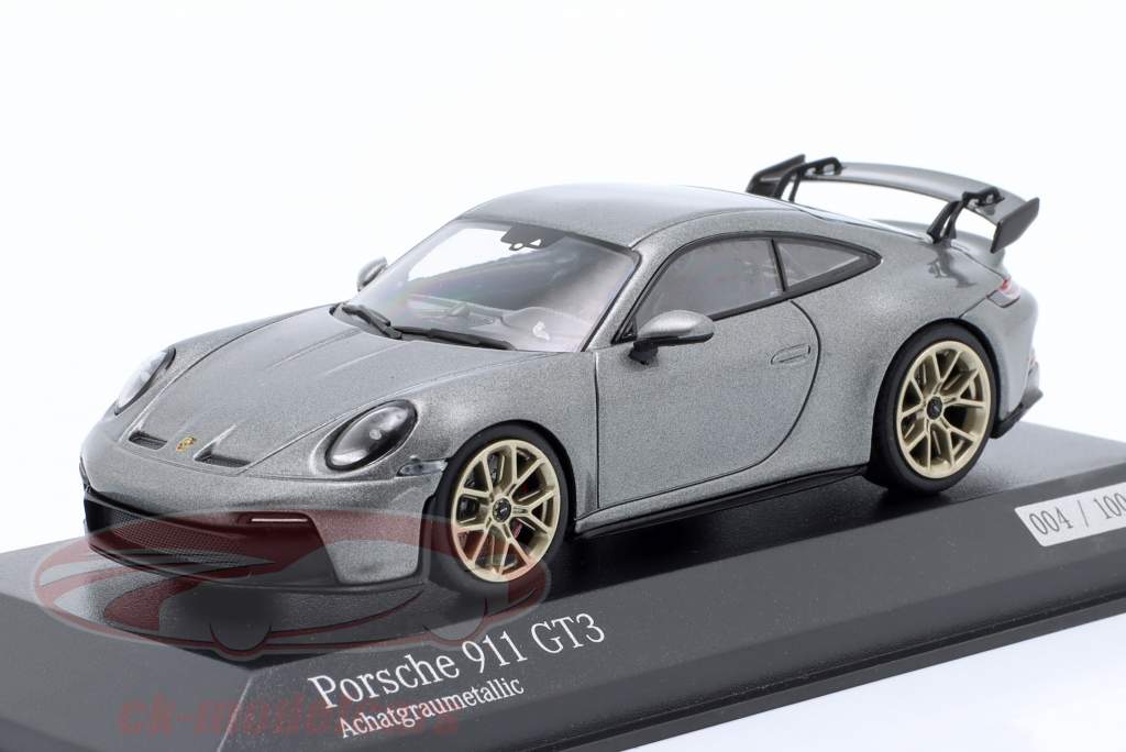 Porsche 911 (992) GT3 2021 gris ágata metálico / dorado llantas 1:43 Minichamps