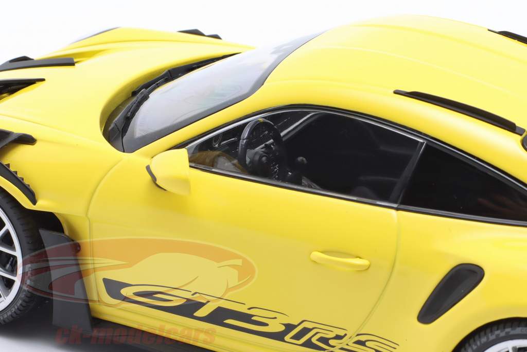 Porsche 911 (992) GT3 RS year 2023 yellow / silver rims 1:18 Minichamps