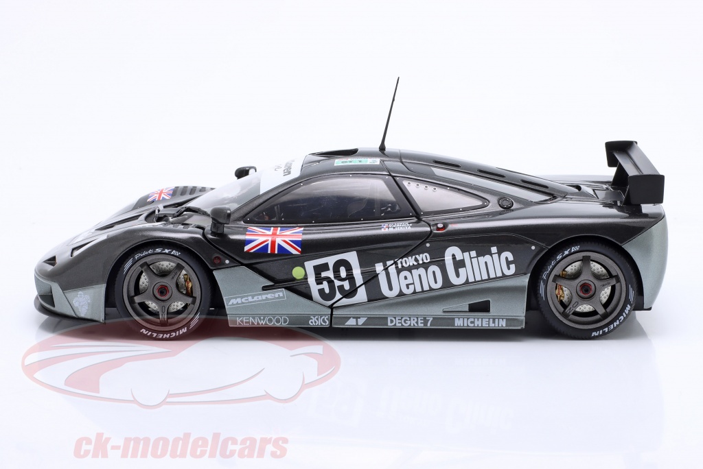 File:The wining Mclaren F1 GTR -59 team of Yannick Dalmas, Masanori Sekiya & J.J.Lehto on the podium at Le Mans 1995 (49627444137).jpg - Wikimedia