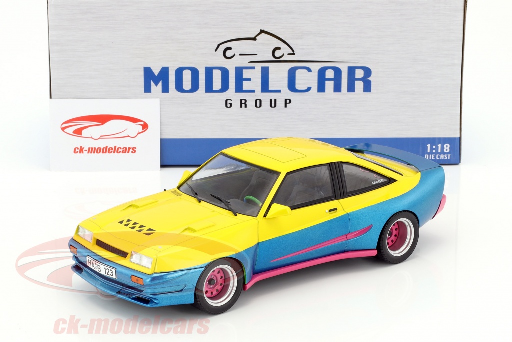 Modelcar Group 1:18 Opel Manta B Mattig película Manta Manta (1991)  amarillo / azul metálico / rosa MCG18095 modelo coche MCG18095 4052176337127